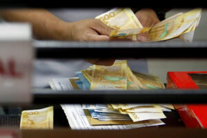 Peso surges to P57 level on remittances